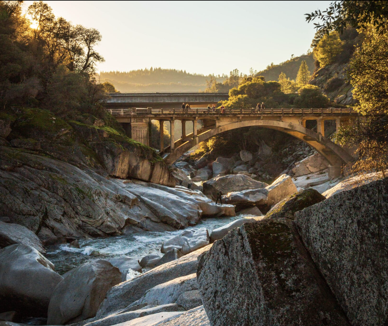 Golden light over the Yuba River canyon and historic stone bridge near Nevada City