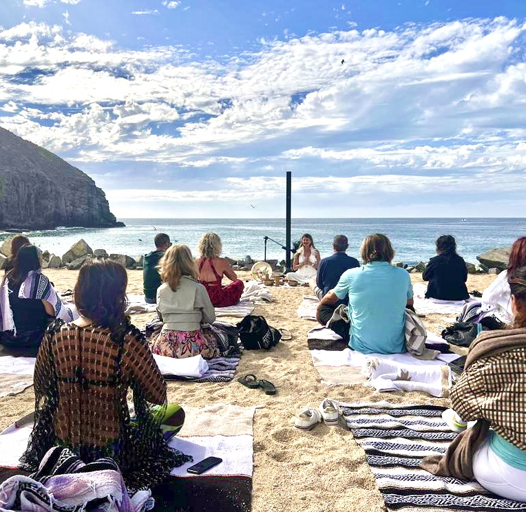 Beachside sound ceremony by the ocean