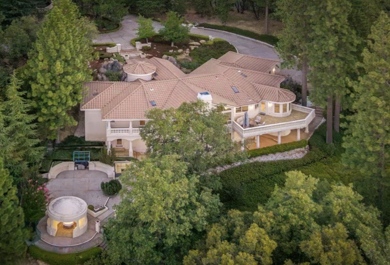 Aerial view of the private Nevada City retreat residence surrounded by forest