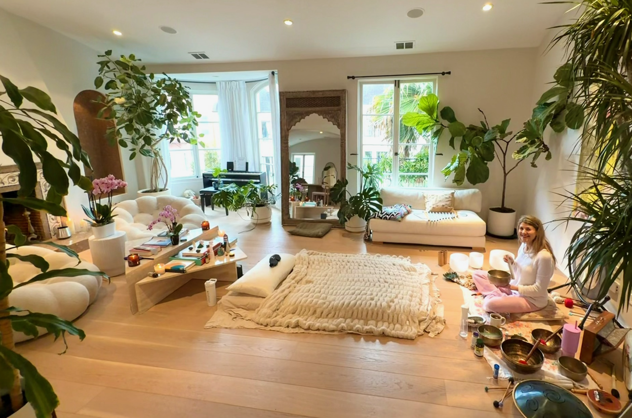 Lisa's sacred sound-bath living-room sanctuary filled with plants and instruments
