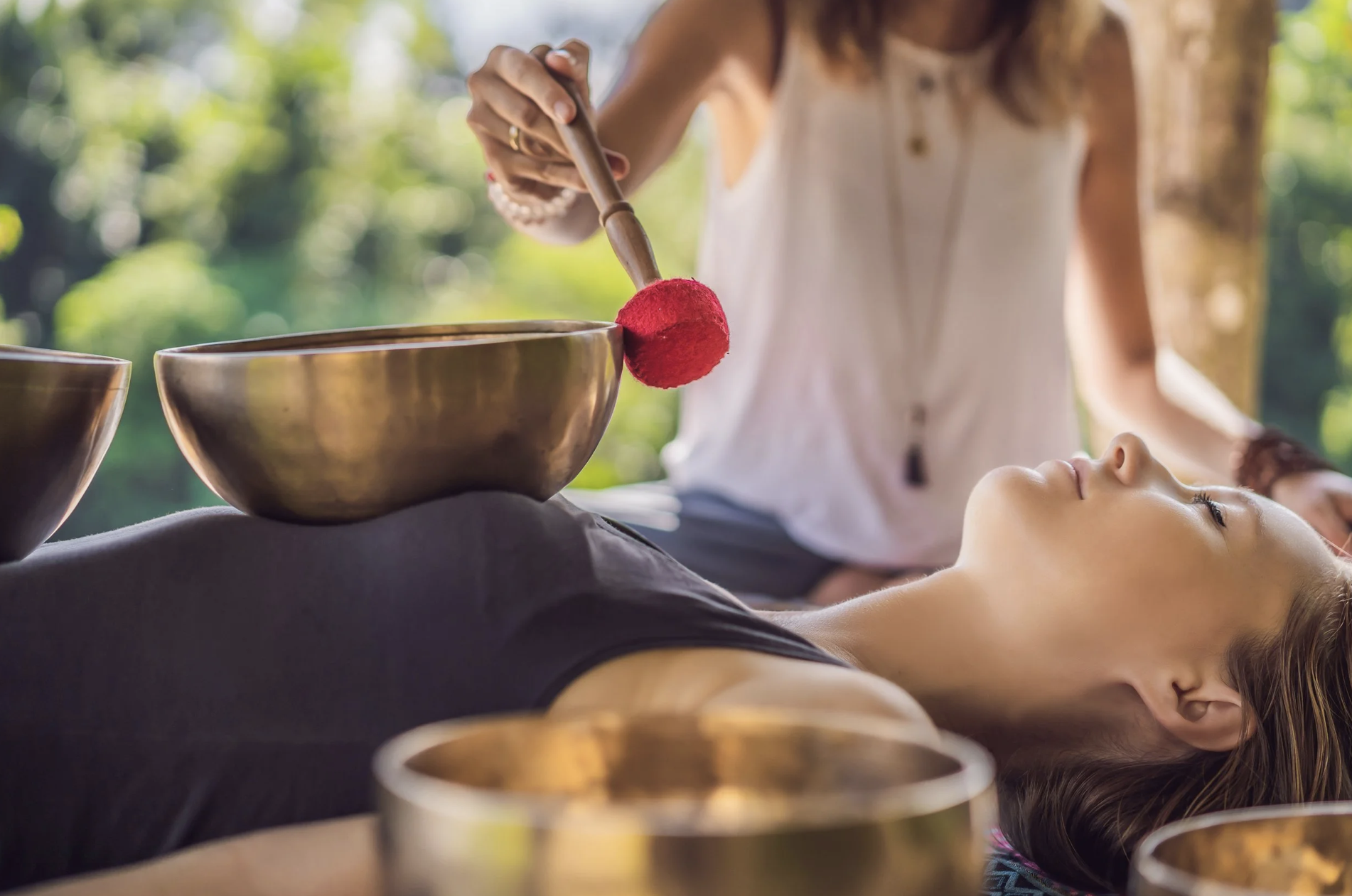 Sound bath with Tibetan singing bowls during a sacred medicine journey